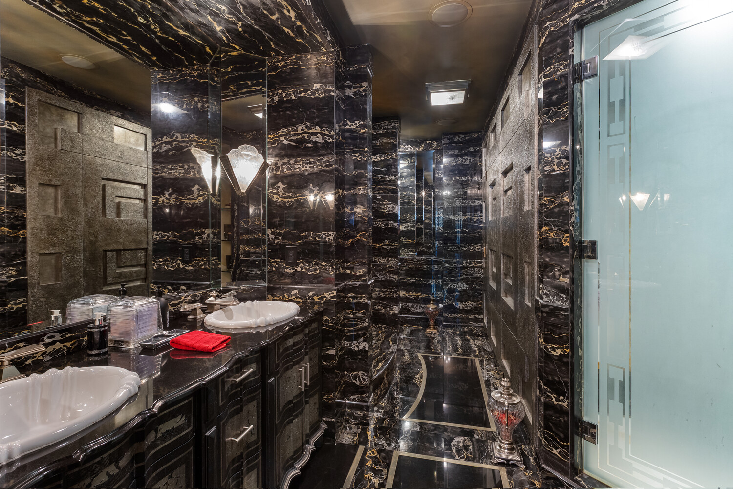 117 East 57th Street, Unit 49D/51D Manhattan, NY 10022 - Photo 21 of 46 a bathroom with a sink