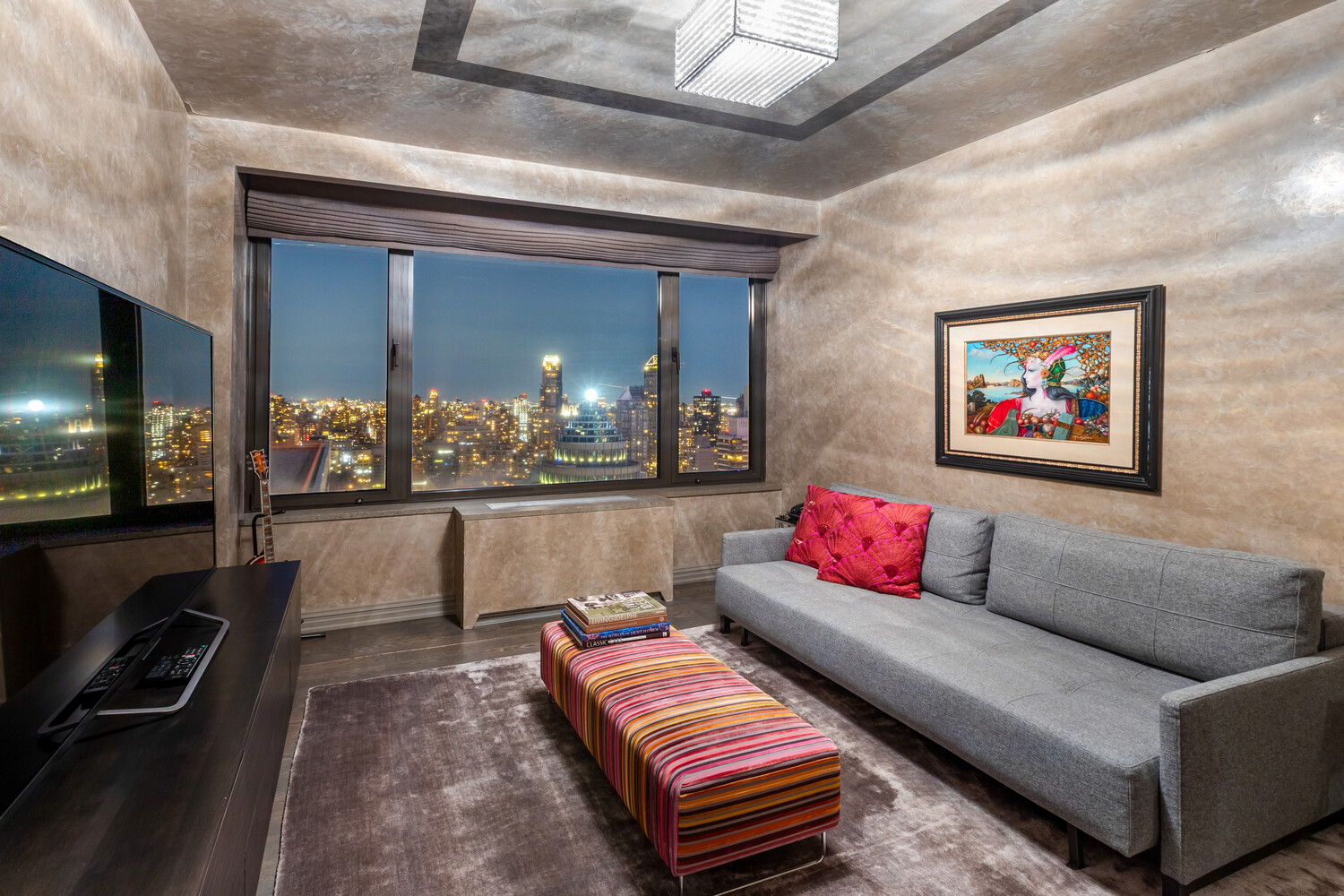 117 East 57th Street, Unit 49D/51D Manhattan, NY 10022 - Photo 25 of 46 a living room with furniture and a flat screen tv