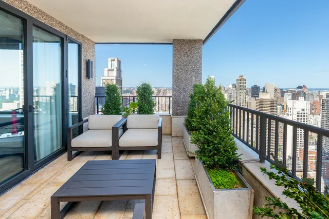 a view of a balcony with chairs