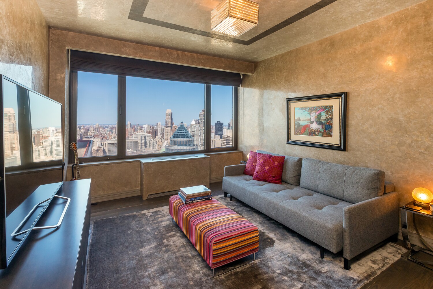 117 East 57th Street, Unit 49D/51D Manhattan, NY 10022 - Photo 30 of 46 a living room with furniture and a large window