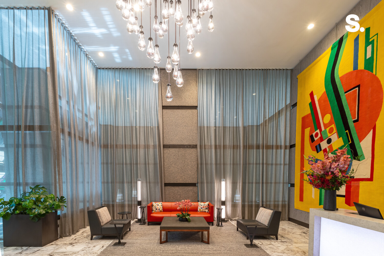 117 East 57th Street, Unit 49D/51D Manhattan, NY 10022 - Photo 41 of 46 a living room with furniture and a chandelier