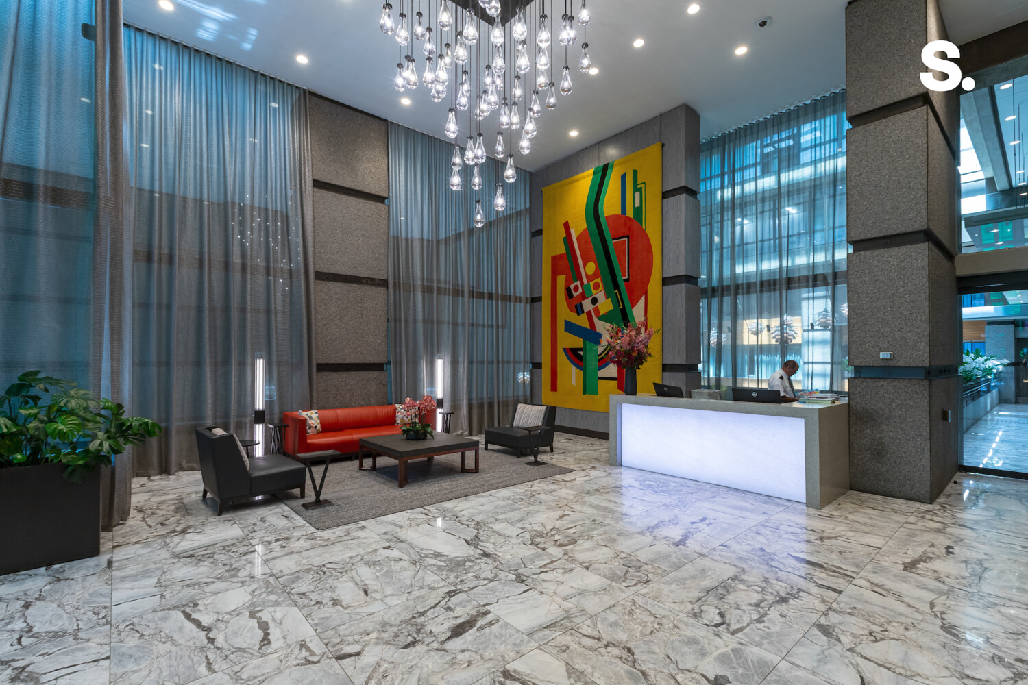 117 East 57th Street, Unit 49D/51D Manhattan, NY 10022 - Photo 42 of 46 a living room filled with furniture and a chandelier