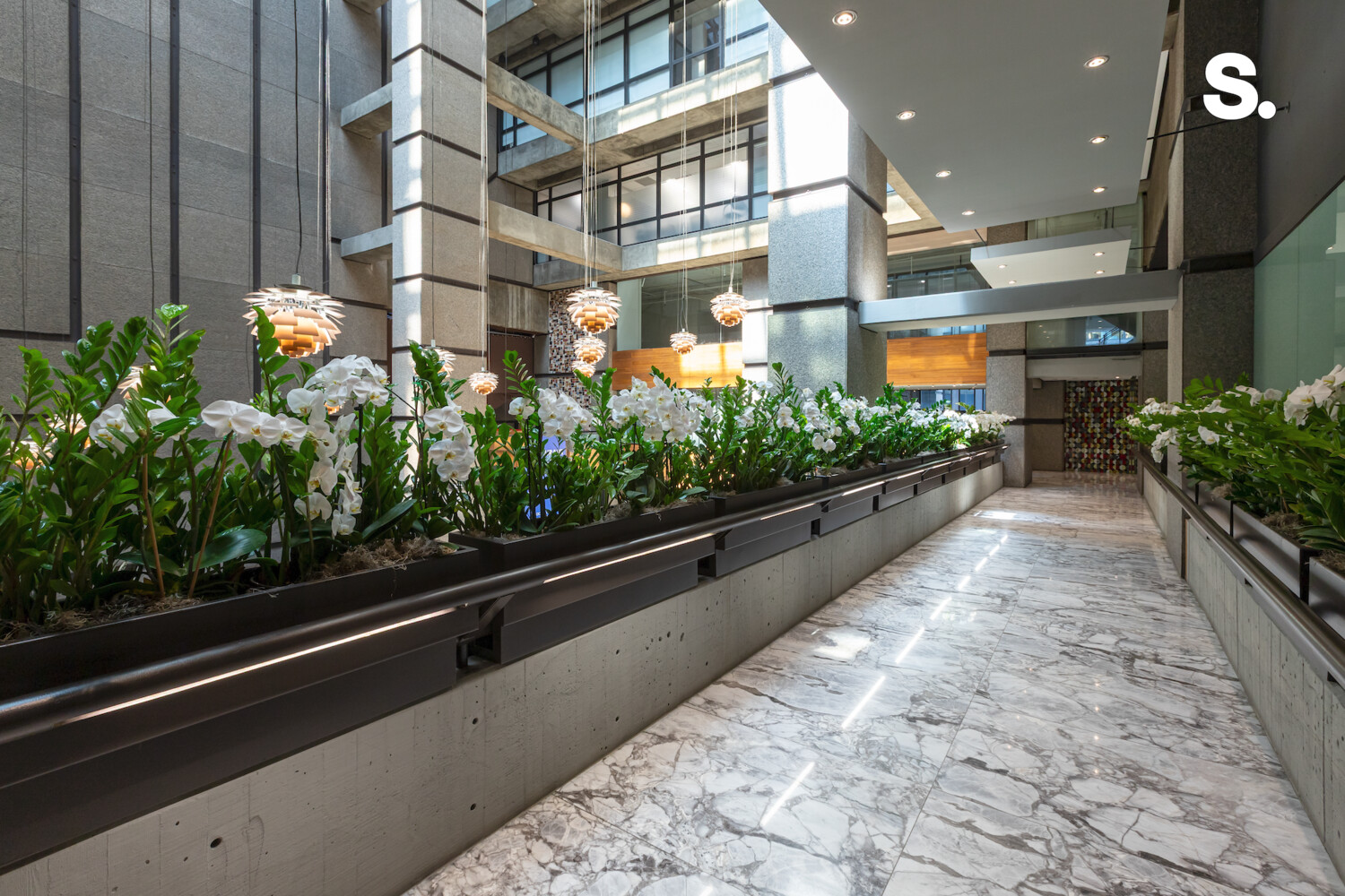 117 East 57th Street, Unit 49D/51D Manhattan, NY 10022 - Photo 43 of 46 a lobby with furniture and potted plants