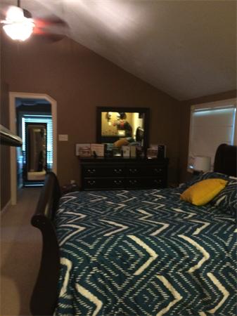 103 Cohasset Road, Unit ROAD Wareham, MA 02532 - Photo 14 of 15 a bedroom with a bed and a flat screen tv