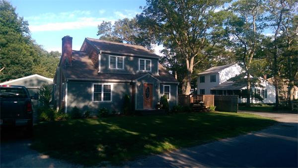 103 Cohasset Road, Unit ROAD Wareham, MA 02532 - Photo 2 of 15 a front view of a house with a garden