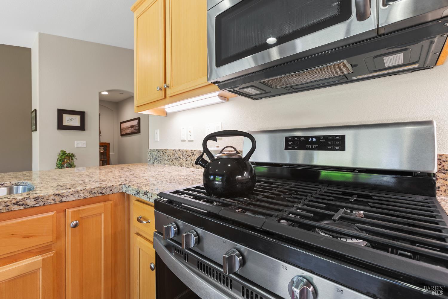 412 Spring Creek Drive Rio Vista, CA 94571 - Photo 16 of 42 a stove top oven sitting inside of a kitchen