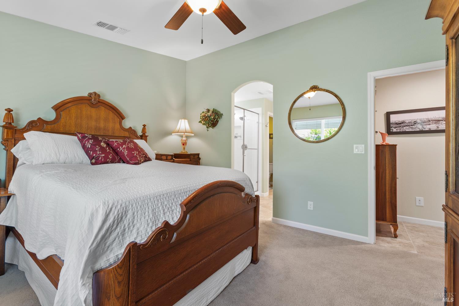 412 Spring Creek Drive Rio Vista, CA 94571 - Photo 19 of 42 a bedroom with a bed and a chandelier