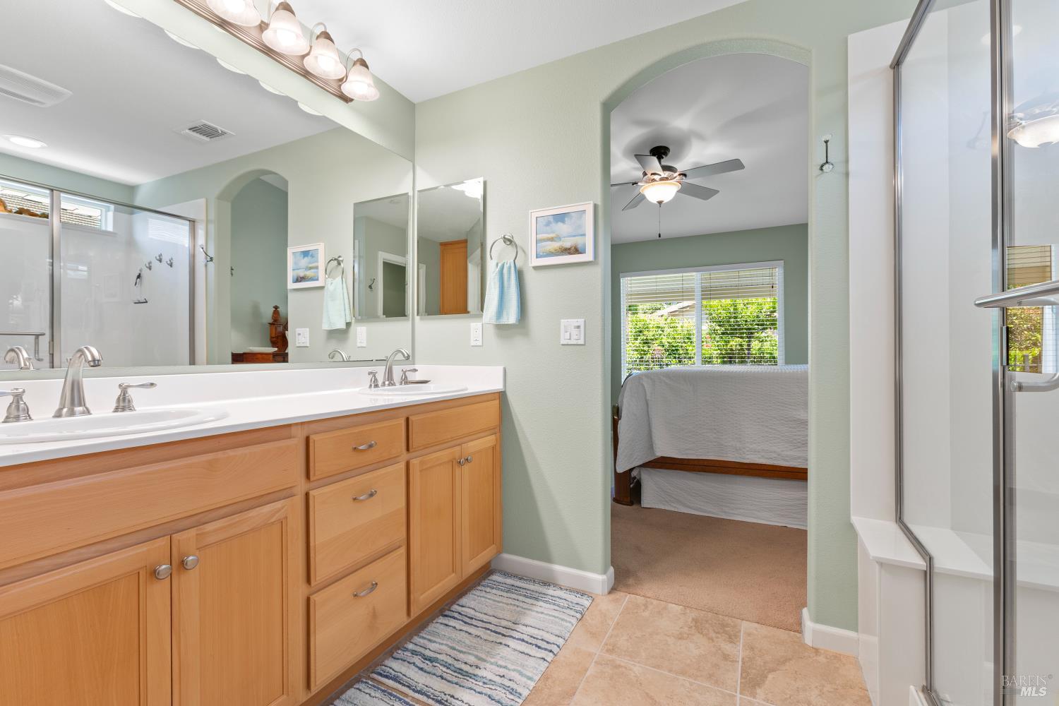 412 Spring Creek Drive Rio Vista, CA 94571 - Photo 23 of 42 a bathroom with a double vanity sink and a mirror