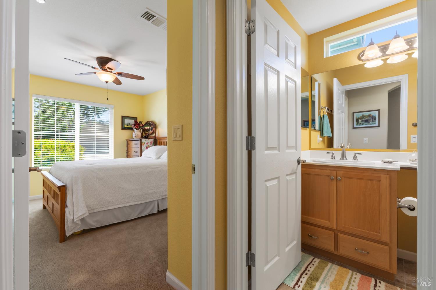412 Spring Creek Drive Rio Vista, CA 94571 - Photo 24 of 42 a bedroom with a bed and a dresser next to a window