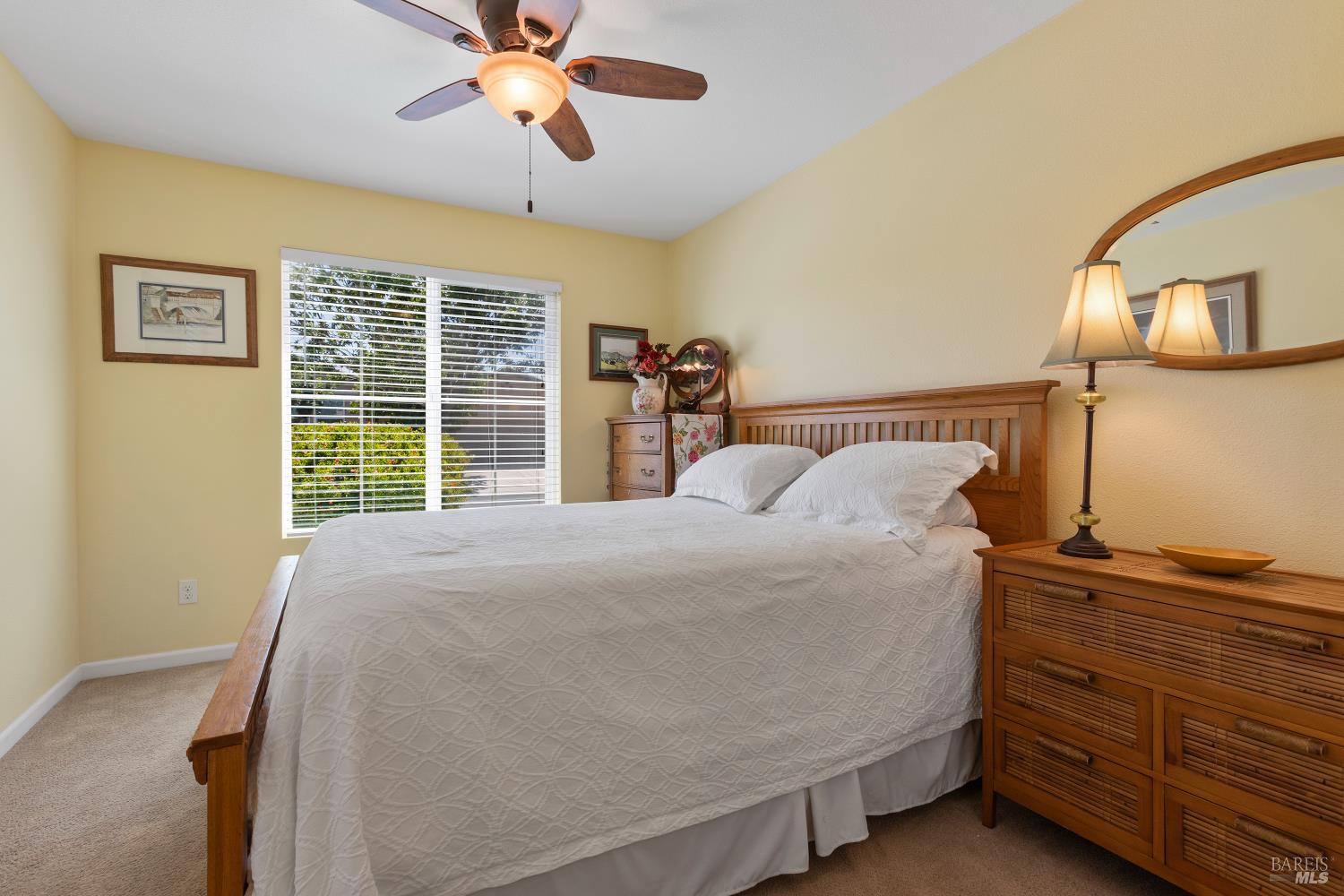 412 Spring Creek Drive Rio Vista, CA 94571 - Photo 26 of 42 a bed sitting in a bedroom next to a window