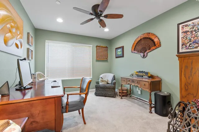 a workspace with furniture and window