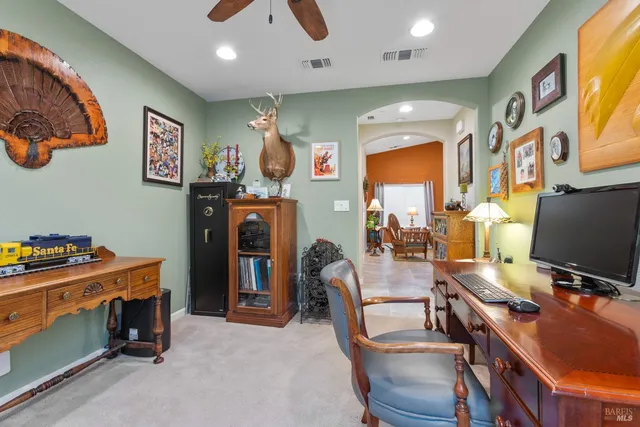 a room with furniture and a flat screen tv