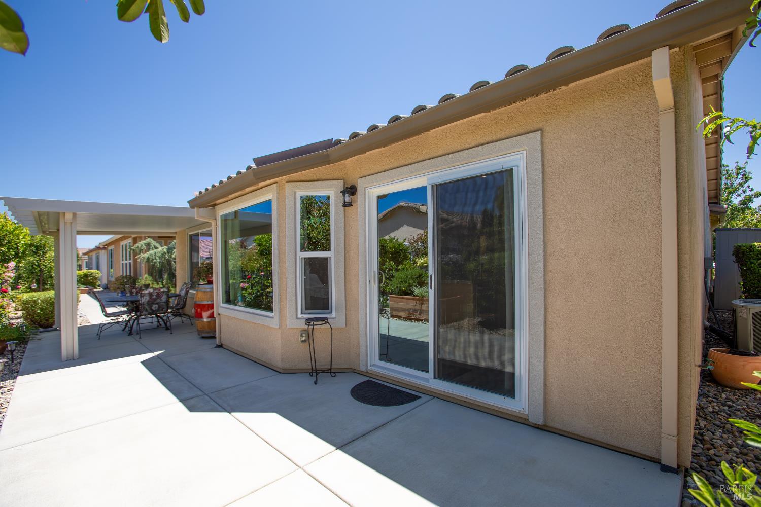 412 Spring Creek Drive Rio Vista, CA 94571 - Photo 34 of 42 a view of a patio with table and chairs in front of it