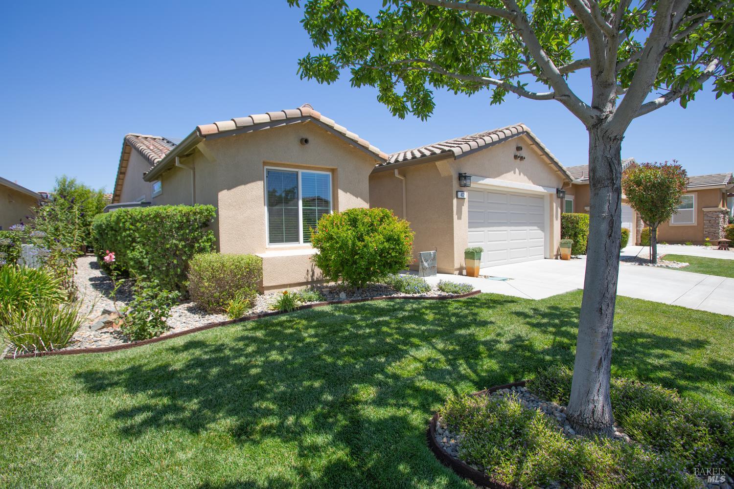 412 Spring Creek Drive Rio Vista, CA 94571 - Photo 5 of 42 a front view of a house with garden