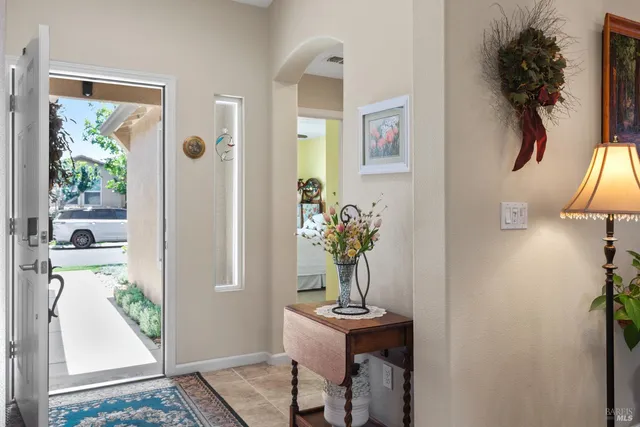 a view of living room filled with furniture and a potted plant