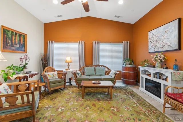 a living room with furniture and a rug