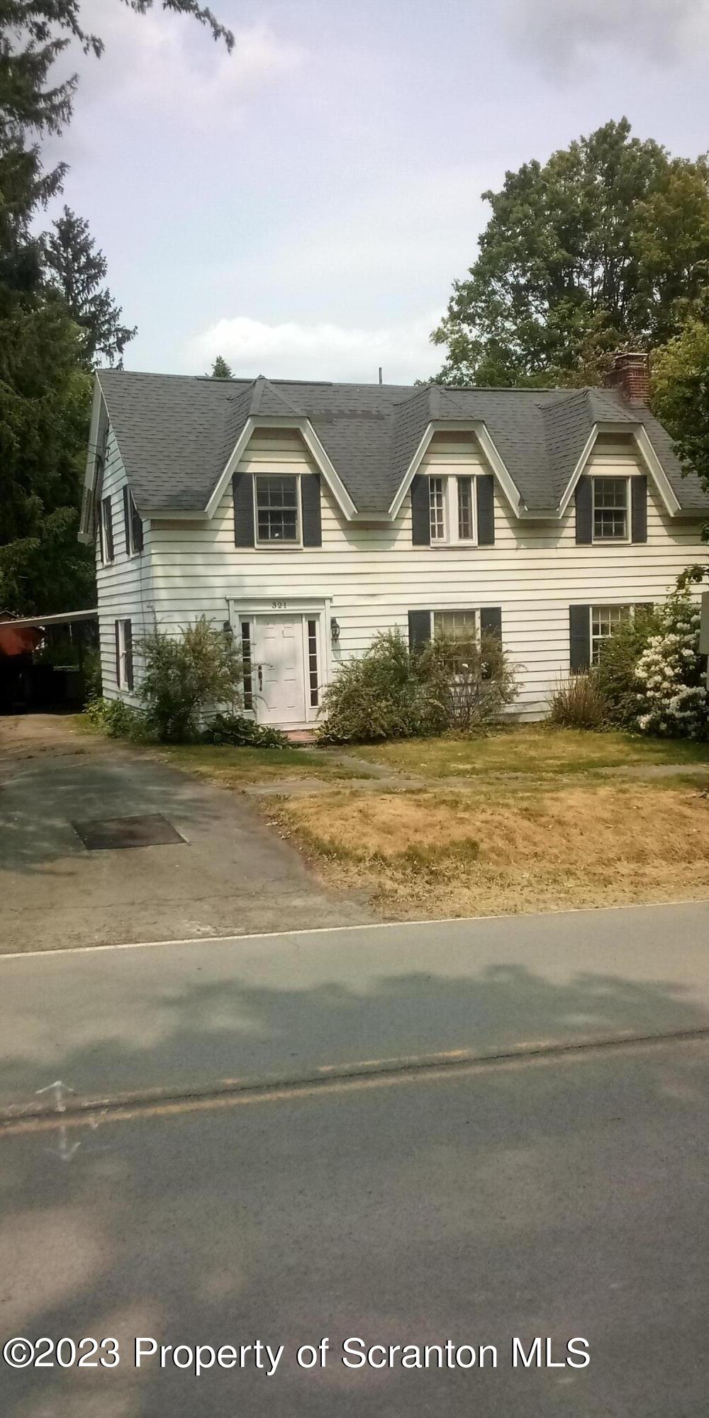 321 Maple Street Montrose, PA 18801 - Photo 2 of 28 a front view of a house with a ocean view