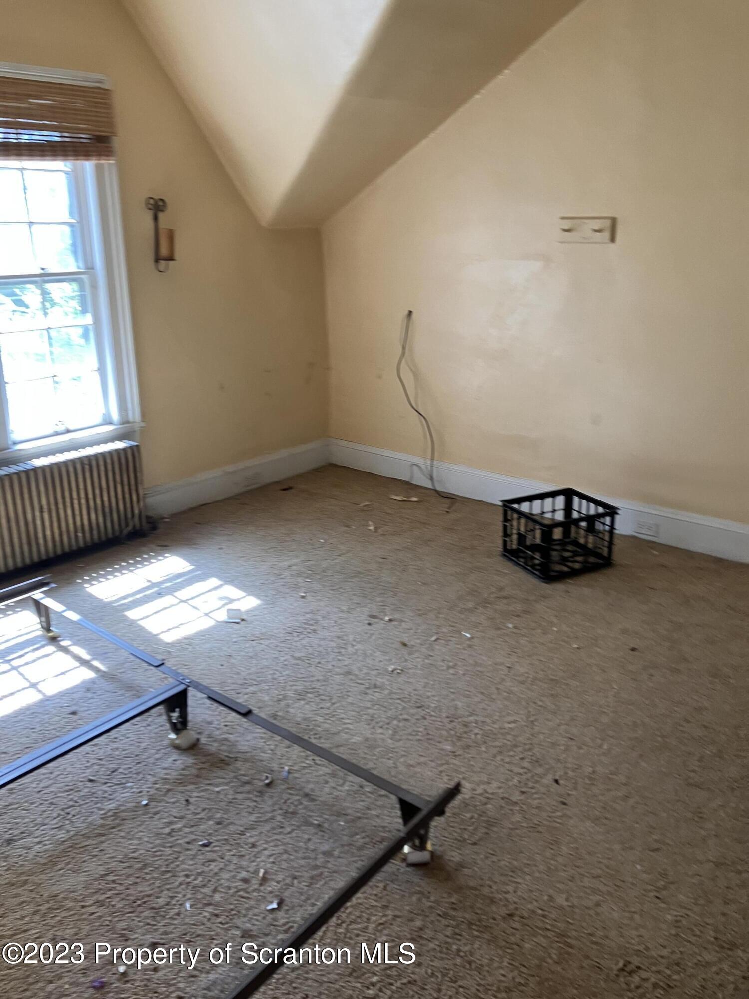 321 Maple Street Montrose, PA 18801 - Photo 21 of 28 a view of a livingroom with wooden floor and a window