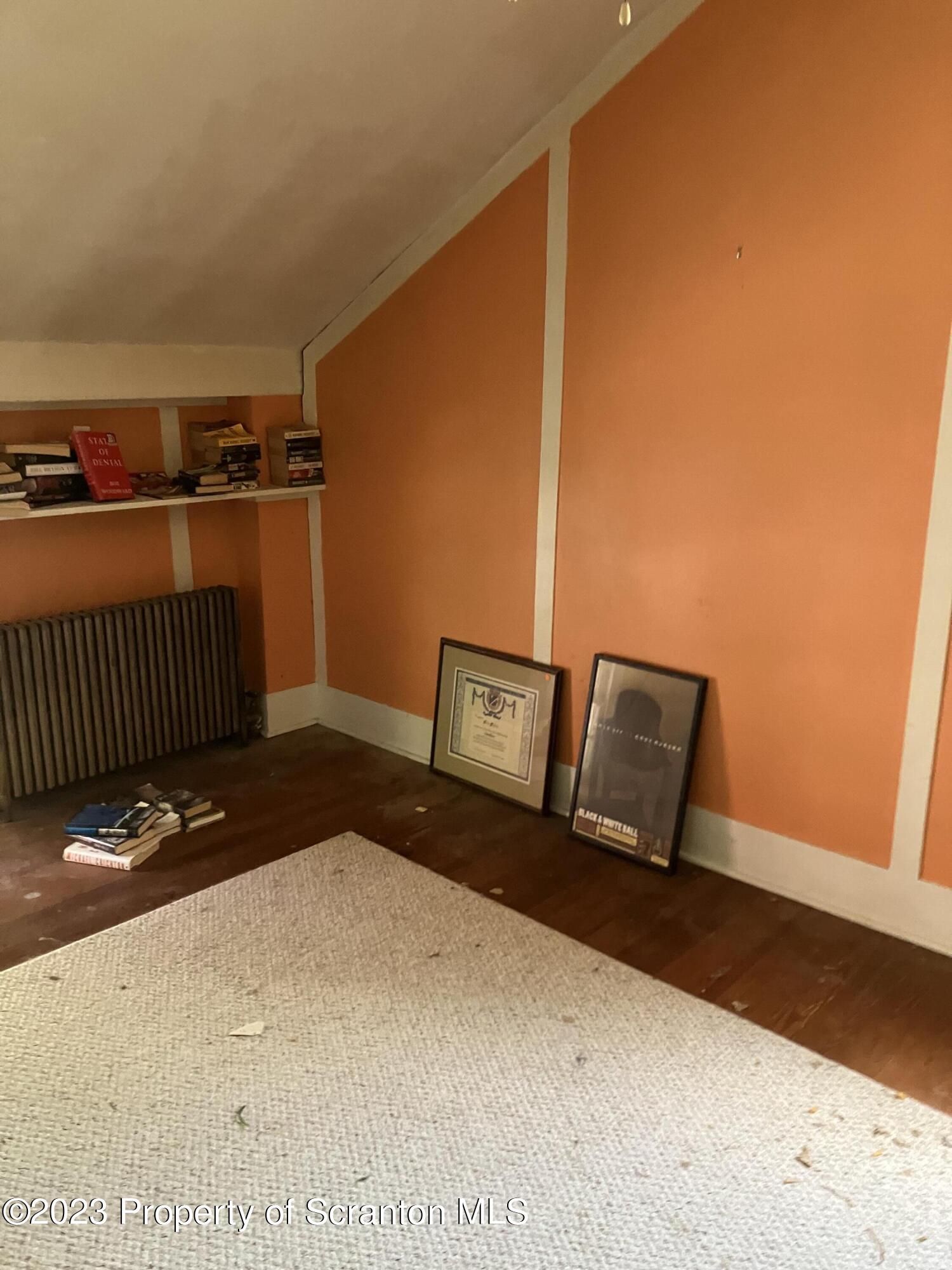 321 Maple Street Montrose, PA 18801 - Photo 23 of 28 a bedroom with a bed and wooden floor