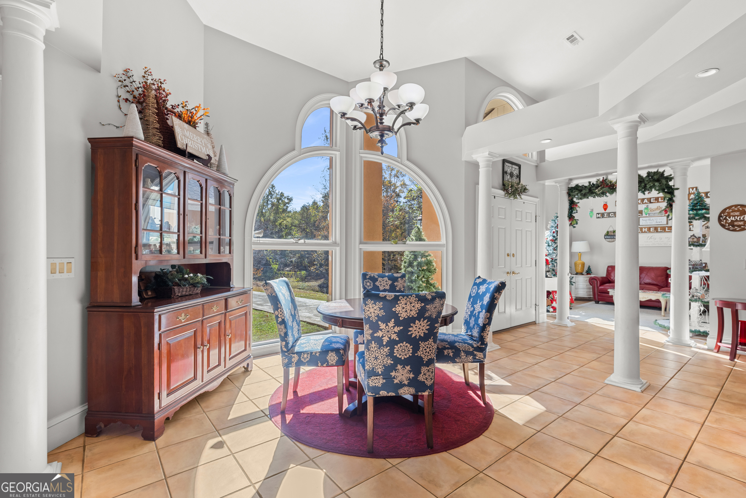 593 Cross Creek Drive Toccoa, GA 30577 - Photo 11 of 55 a view of a dining room with furniture a chandelier and large window