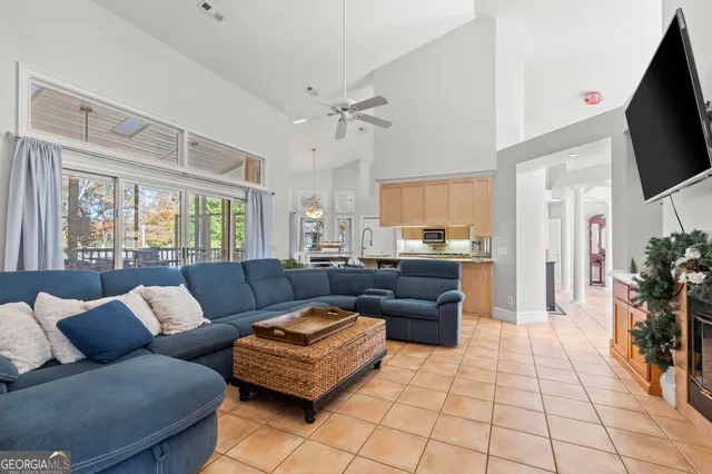 a kitchen with stainless steel appliances granite countertop a stove top oven a sink dishwasher and a refrigerator