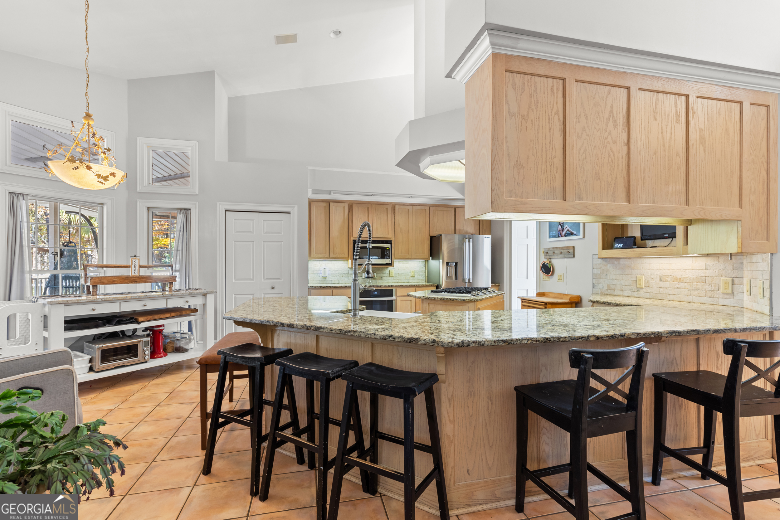 593 Cross Creek Drive Toccoa, GA 30577 - Photo 15 of 55 a kitchen with stainless steel appliances granite countertop table chairs sink and cabinets