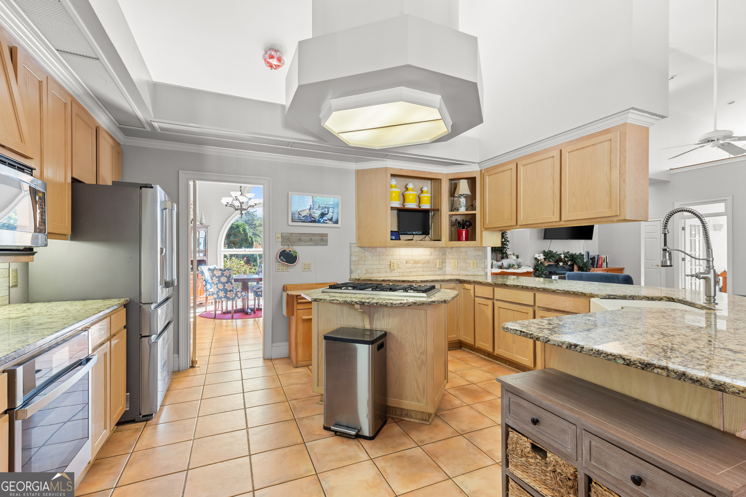593 Cross Creek Drive Toccoa, GA 30577 - Photo 16 of 55 a kitchen with stainless steel appliances granite countertop a stove top oven a sink dishwasher and a refrigerator