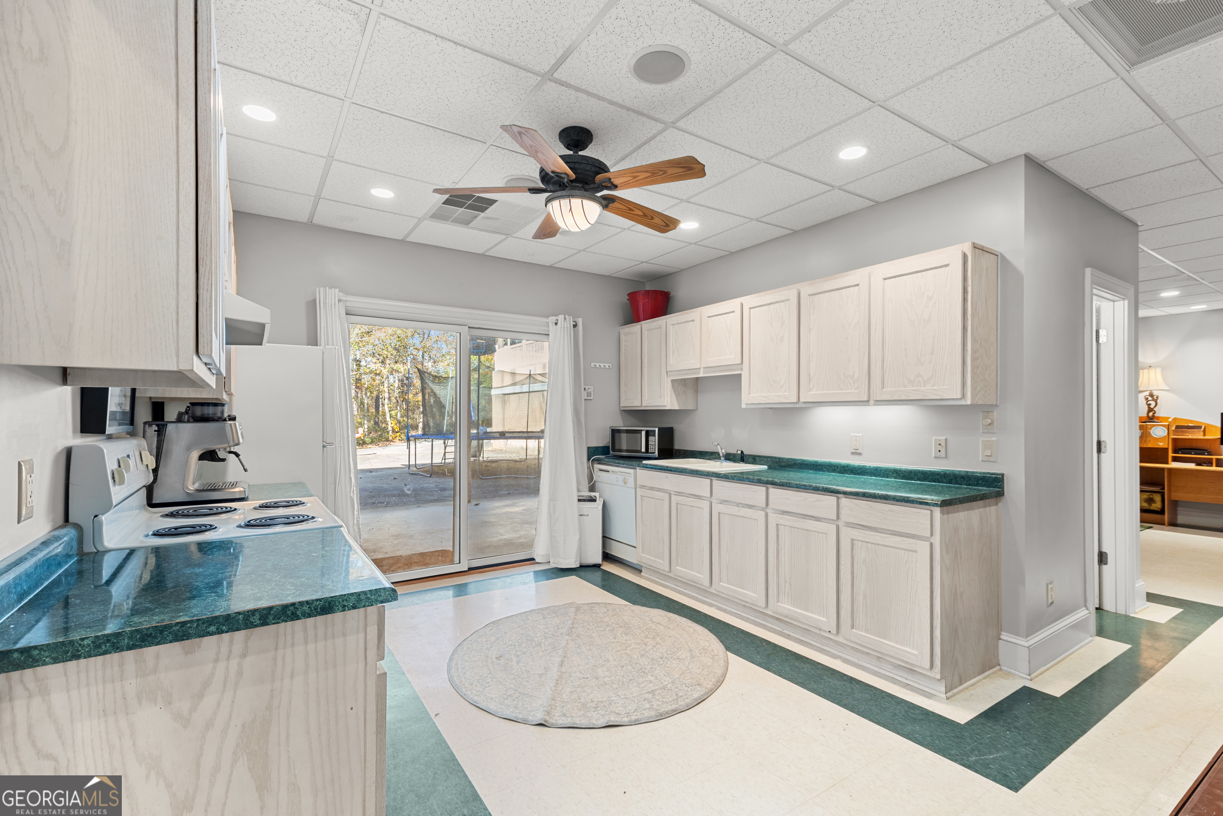593 Cross Creek Drive Toccoa, GA 30577 - Photo 37 of 55 a kitchen with granite countertop a sink a counter top space appliances and cabinets