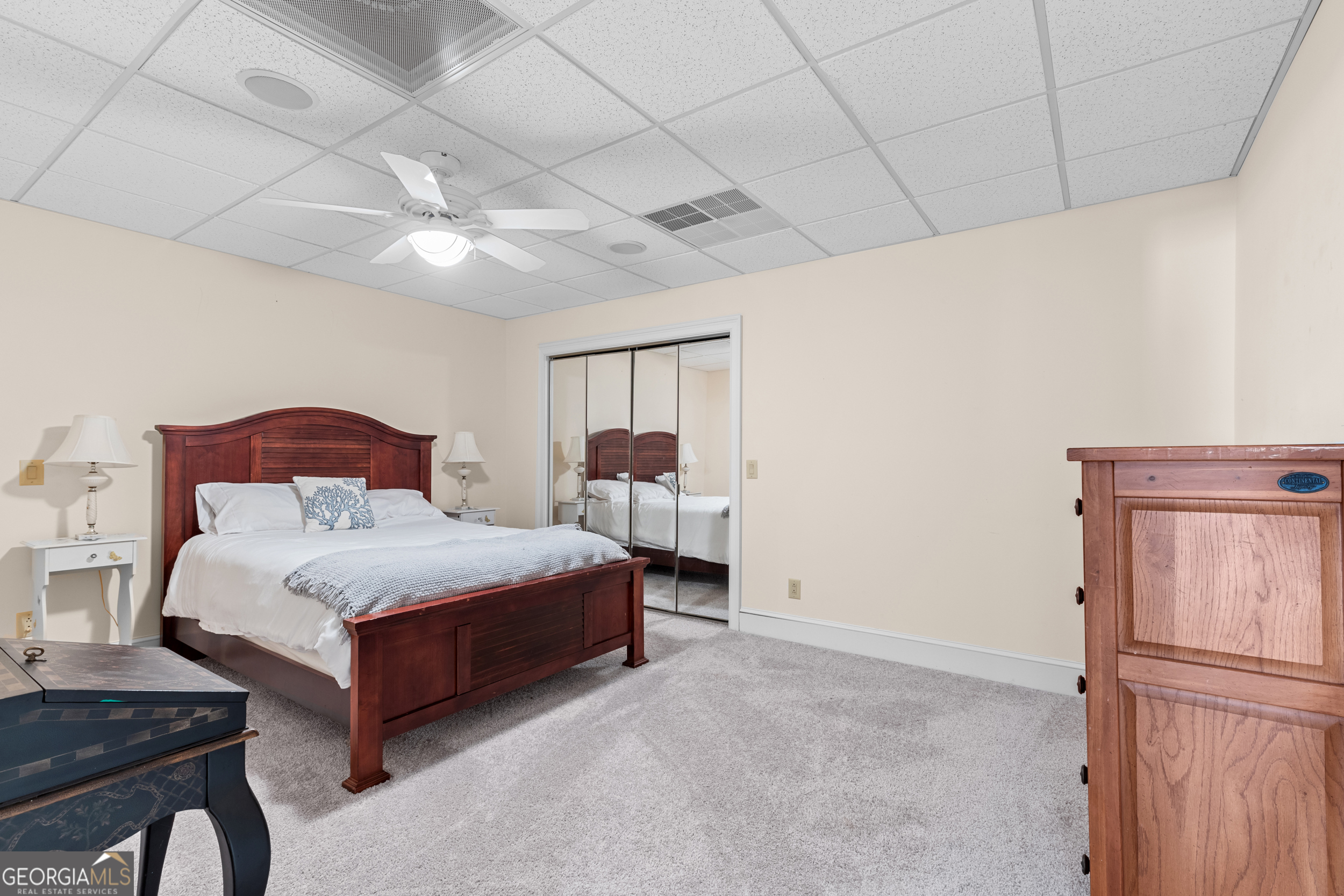 593 Cross Creek Drive Toccoa, GA 30577 - Photo 42 of 55 a spacious bedroom with a bed and a chandelier