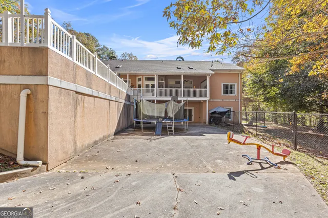 a view of a house with wooden floor and a yard