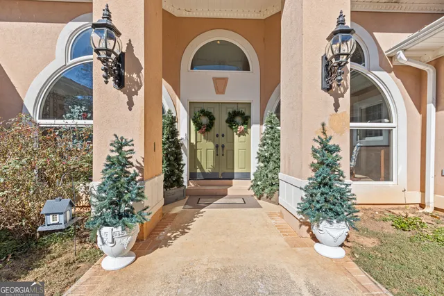 a living room with furniture and flowers