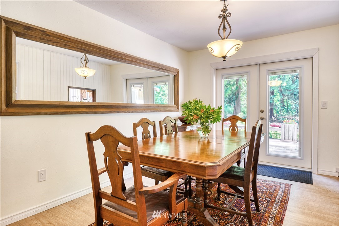 2172 Foxhole Road Point Roberts, WA 98281 - Photo 15 of 40 a view of a dining room with furniture window and wooden floor