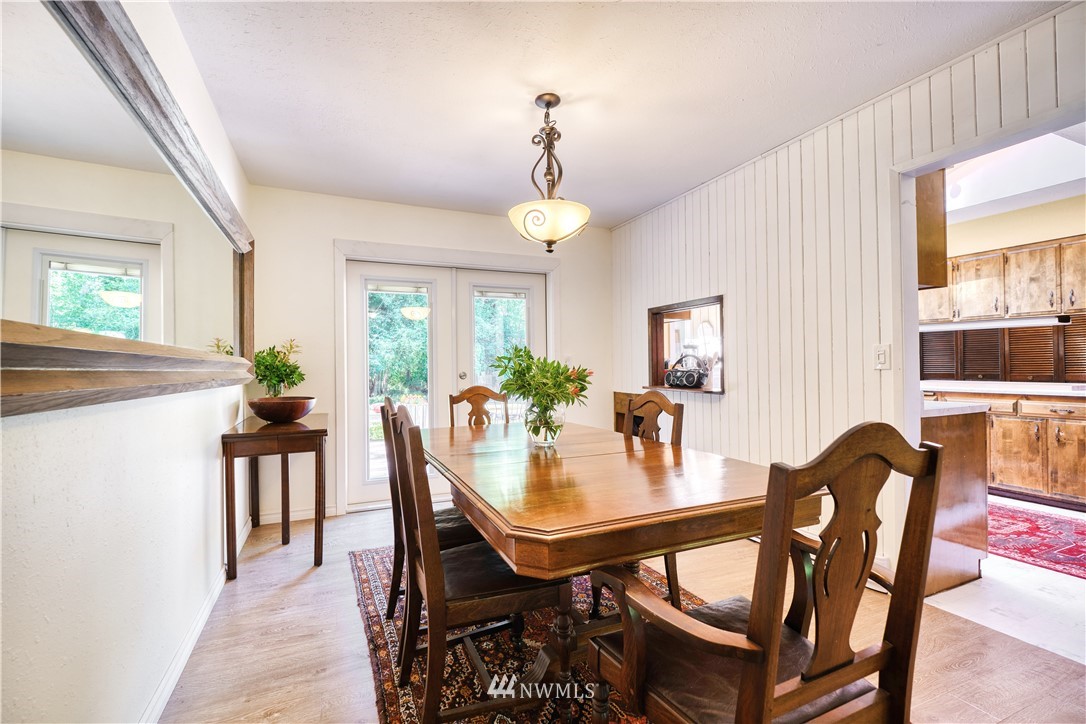 2172 Foxhole Road Point Roberts, WA 98281 - Photo 17 of 40 a view of a dining room with furniture window and wooden floor
