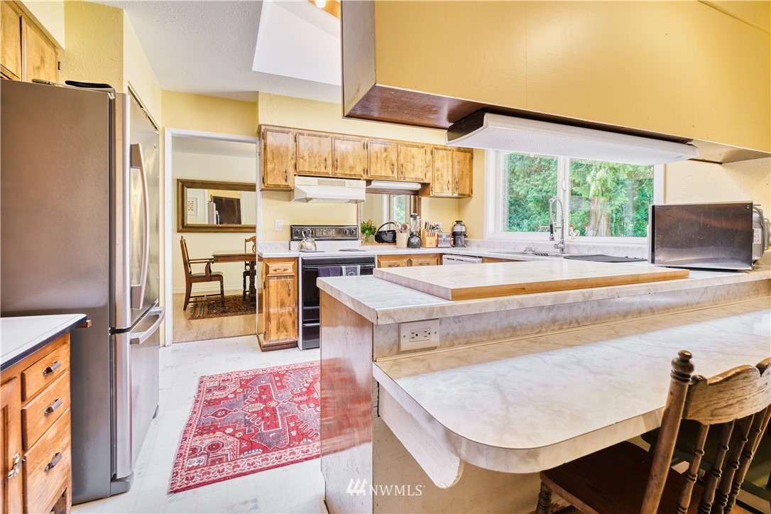 2172 Foxhole Road Point Roberts, WA 98281 - Photo 20 of 40 a living room with stainless steel appliances granite countertop furniture and a large window
