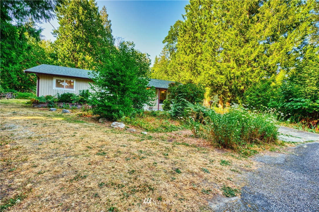 2172 Foxhole Road Point Roberts, WA 98281 - Photo 3 of 40 a view of a house with a yard