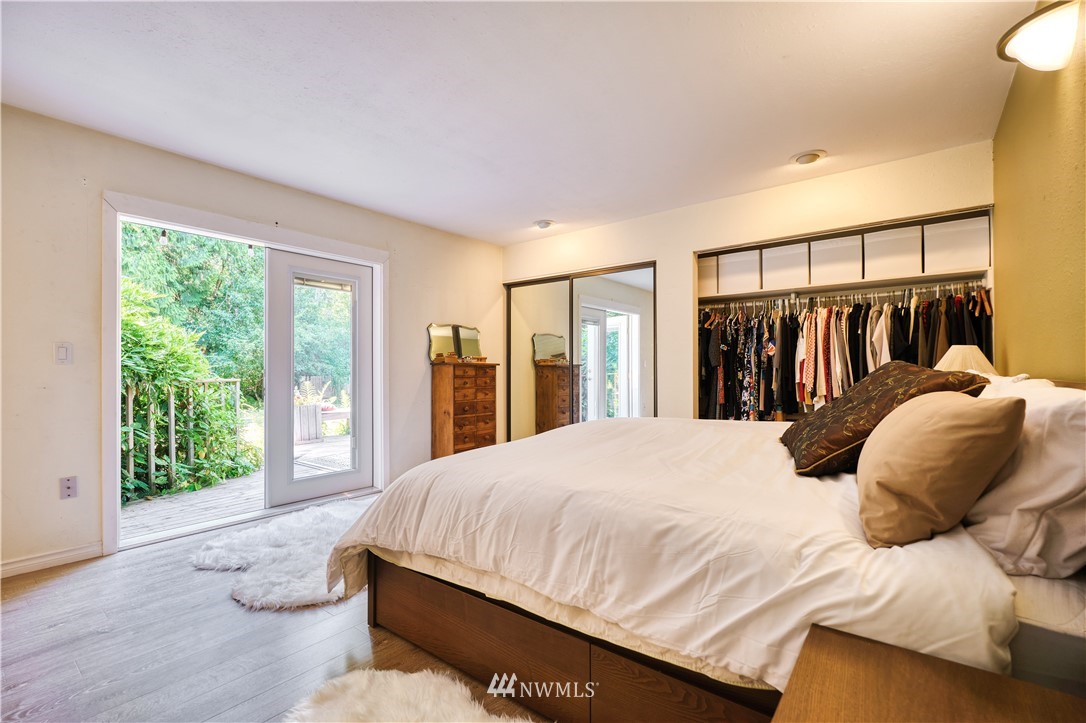 2172 Foxhole Road Point Roberts, WA 98281 - Photo 31 of 40 a bedroom with a large bed and a large window