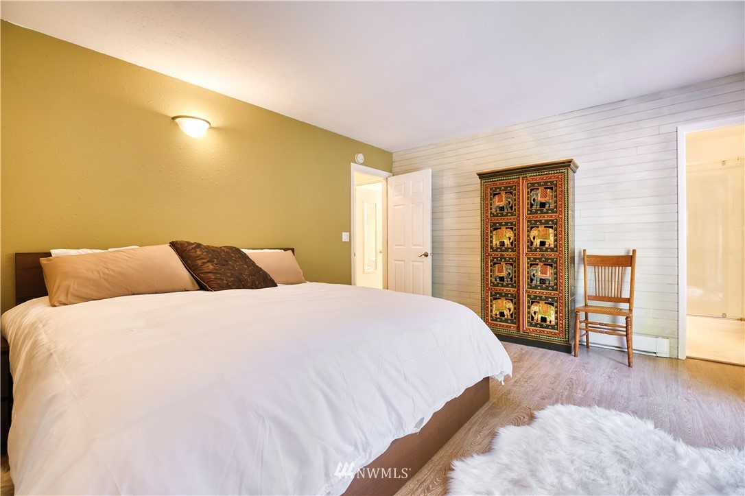 2172 Foxhole Road Point Roberts, WA 98281 - Photo 32 of 40 a bedroom with a bed and wooden floor