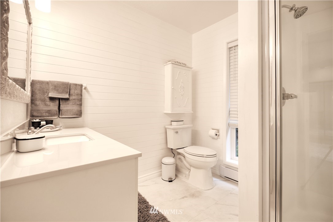 2172 Foxhole Road Point Roberts, WA 98281 - Photo 33 of 40 a bathroom with a sink a toilet and shower