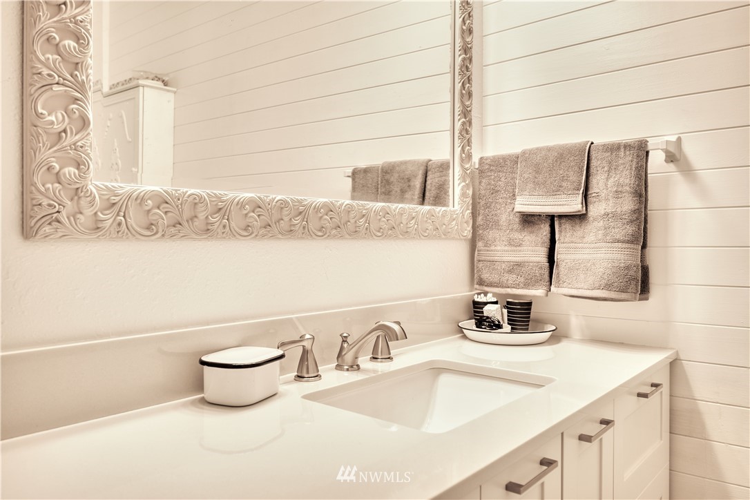 2172 Foxhole Road Point Roberts, WA 98281 - Photo 34 of 40 a bathroom with a sink and a mirror