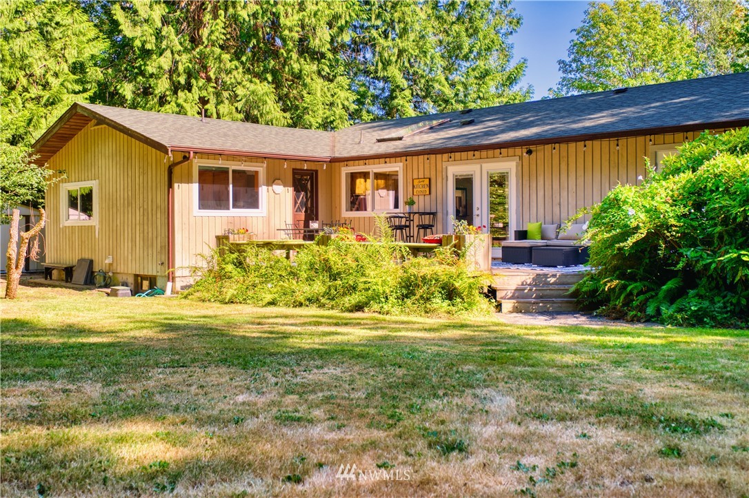 2172 Foxhole Road Point Roberts, WA 98281 - Photo 5 of 40 a view of a house with backyard and sitting area