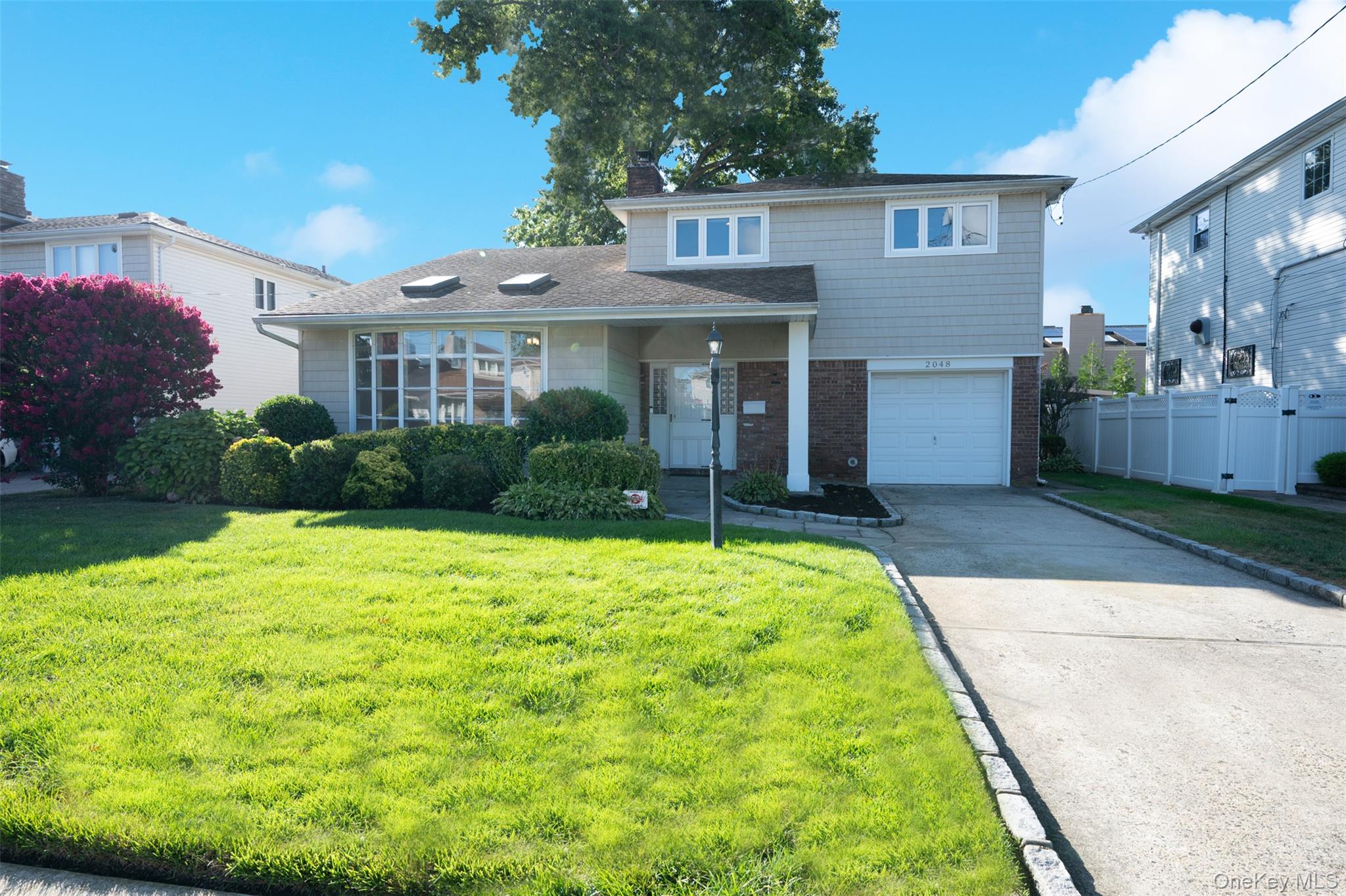 2048 Holland Way Merrick, NY 11566 - Photo 1 of 1 a house view with a garden space