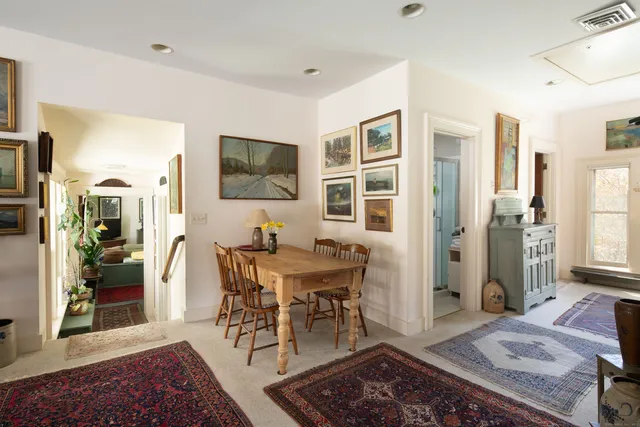a view of a livingroom with furniture and a rug