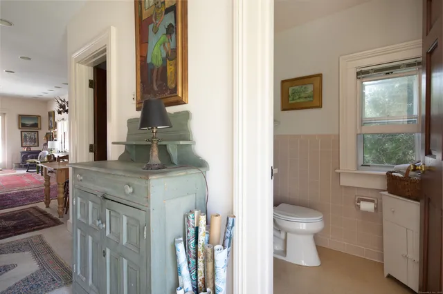 a bathroom with a granite countertop shower mirror and a sink