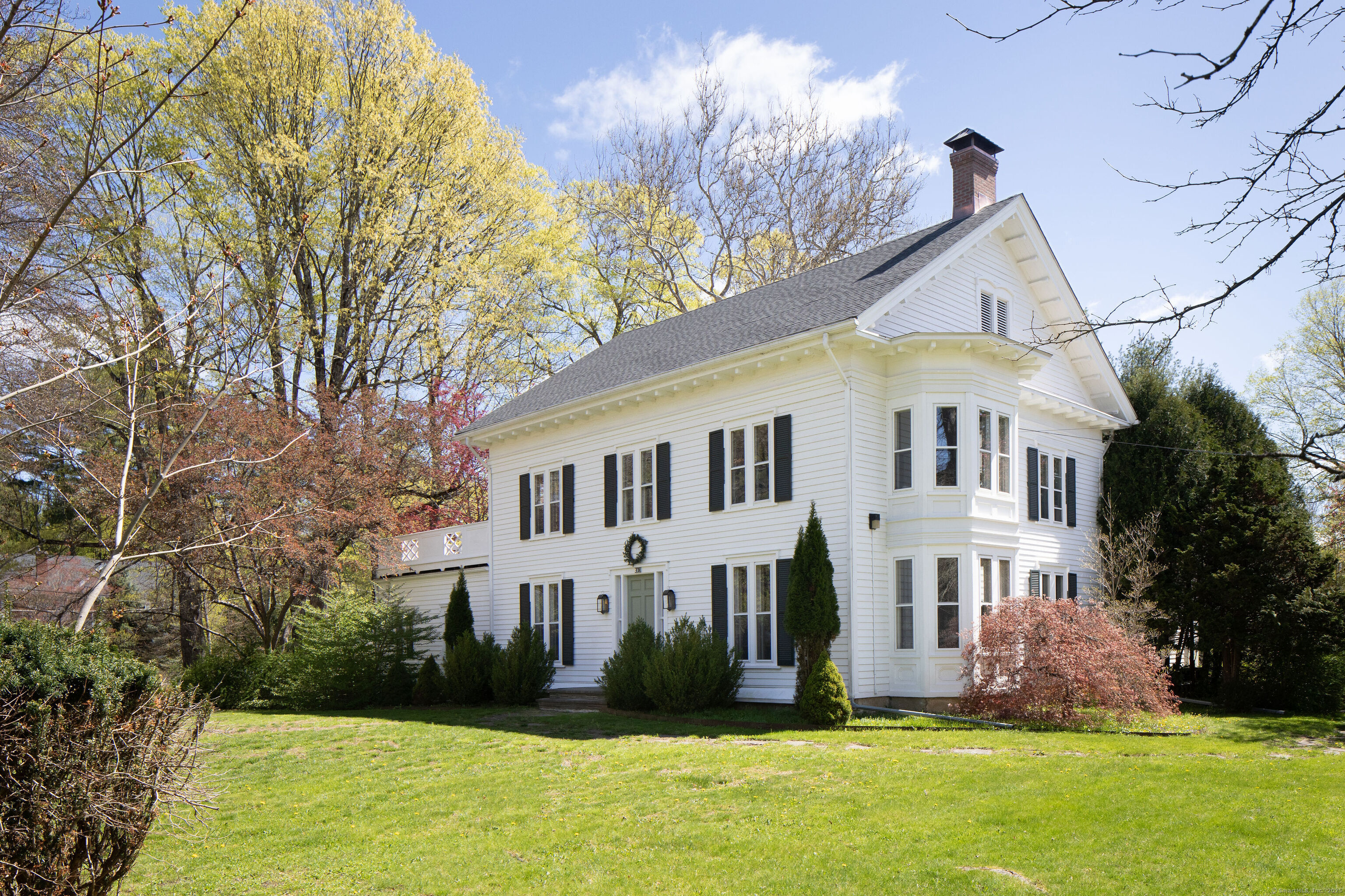 308 Main Street Salisbury, CT 06039 - Photo 32 of 35 a front view of a house with a yard and trees