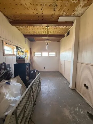 a view of a livingroom with furniture and staircase