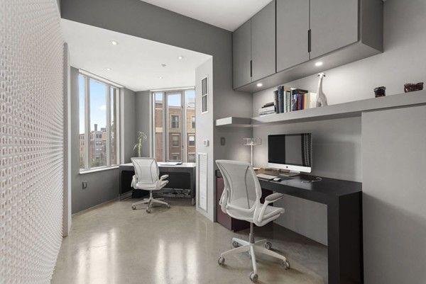 a workspace with furniture and a window