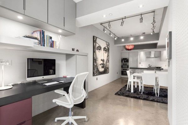 a view of a kitchen with kitchen island stainless steel appliances wooden floor dining table and chairs