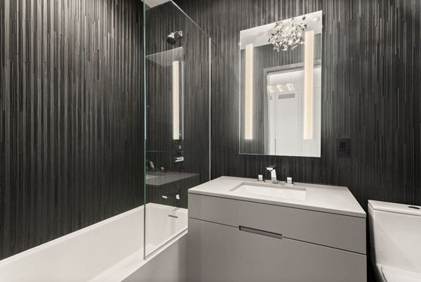 a bathroom with a bathtub and a sink