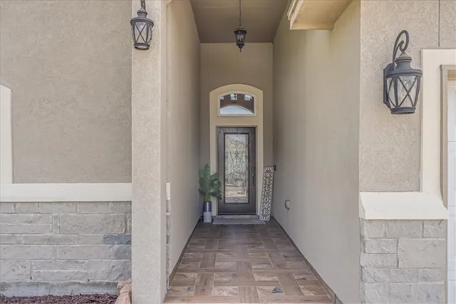 a view of an entryway with wooden floor