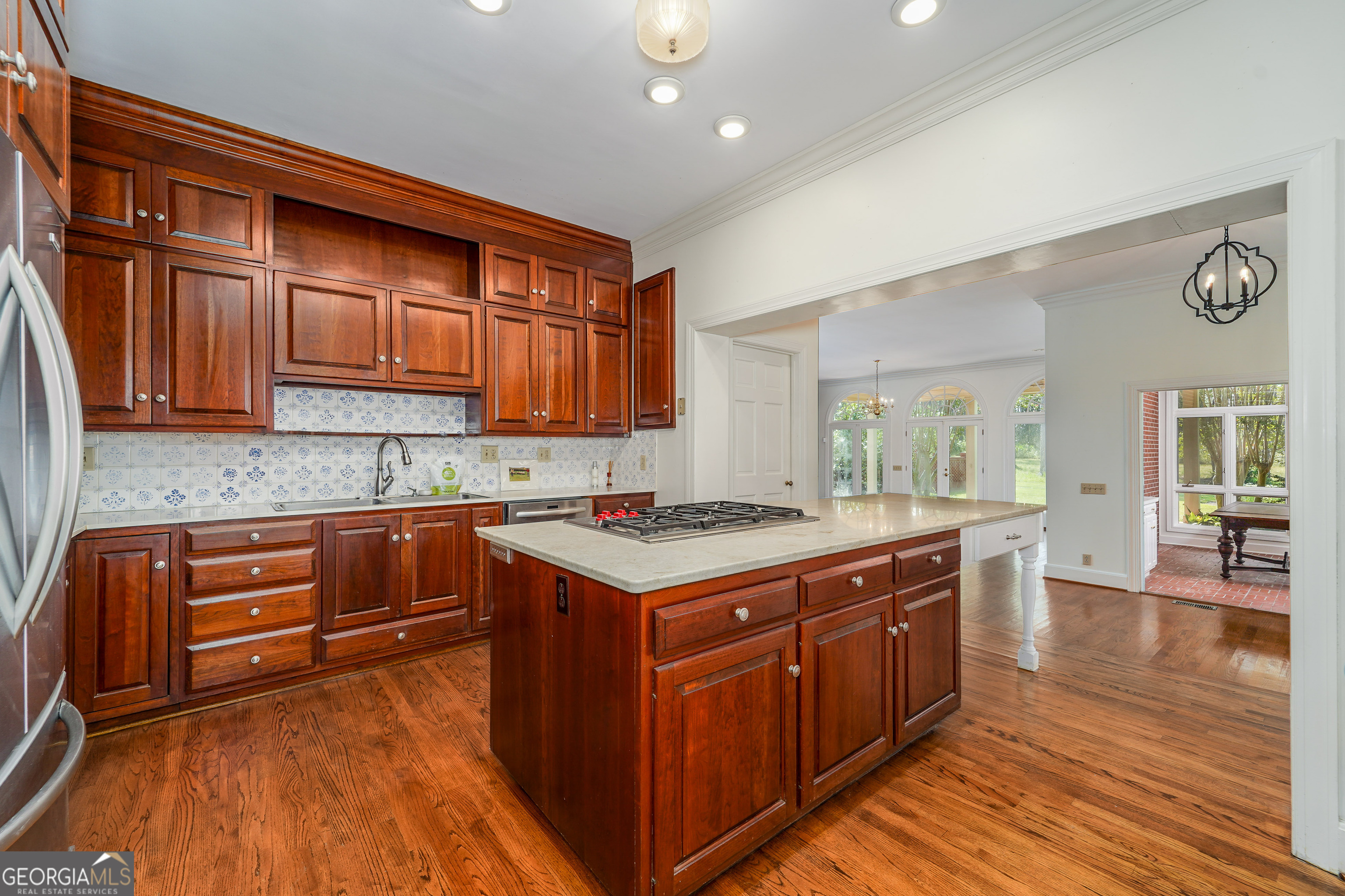 1602 Ward St Extension West Douglas, GA 31533 - Photo 26 of 70 a kitchen with wooden cabinets and sink
